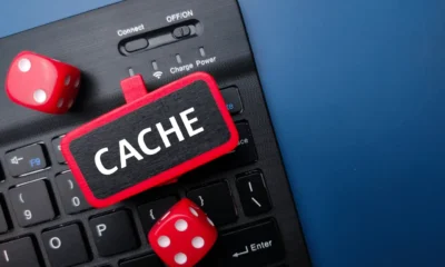 keyboard and red dice with the word cache busines 2023 03 11 04 57 01 utc Large 1